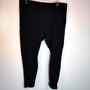 Fabletics Black High Compression Leggings with mesh side panels and pockets 3x